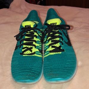 Kid’s Nike Free Flyknit Running Shoes.